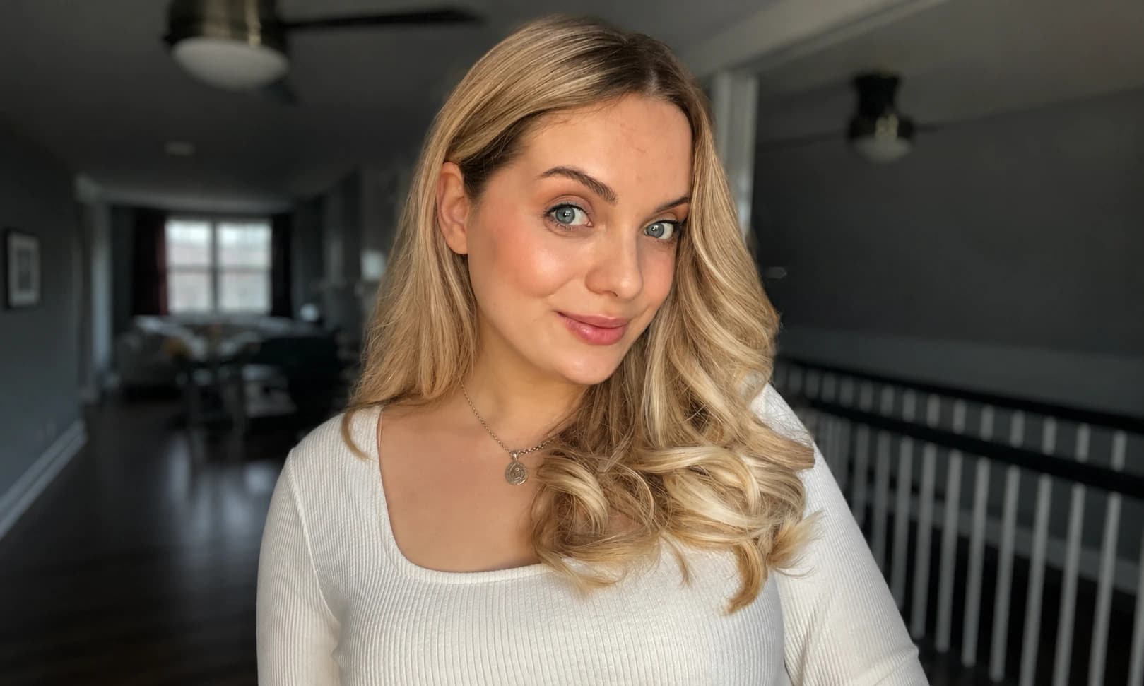 Model with healthy, smooth blonde styled hair